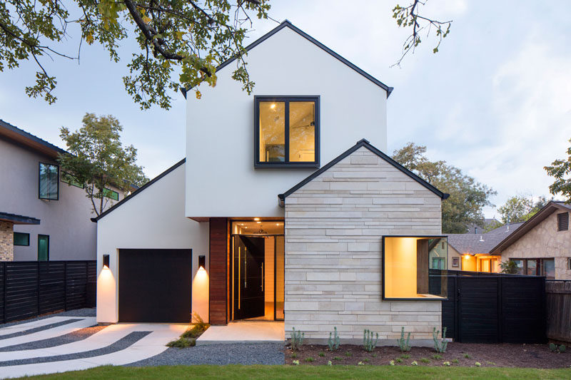 This modern house on a residential street in Austin, Texas, features an exterior of limestone, wood and stucco.